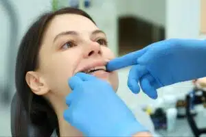 Orthodontist checking retainer fit